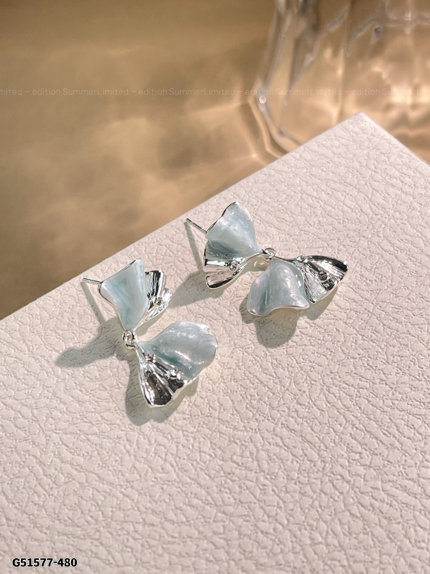Inverted bow earrings