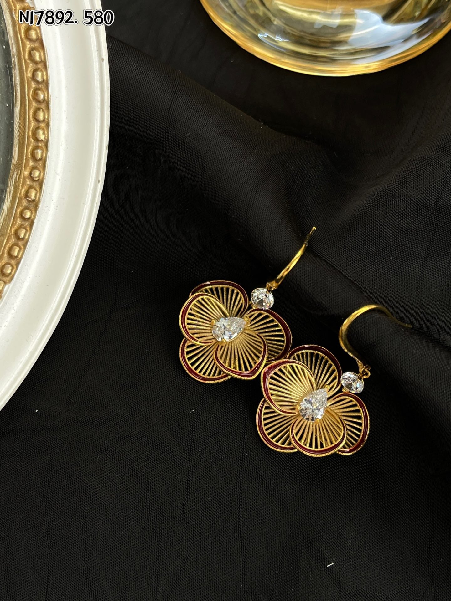 Detailed gold metal flower earrings