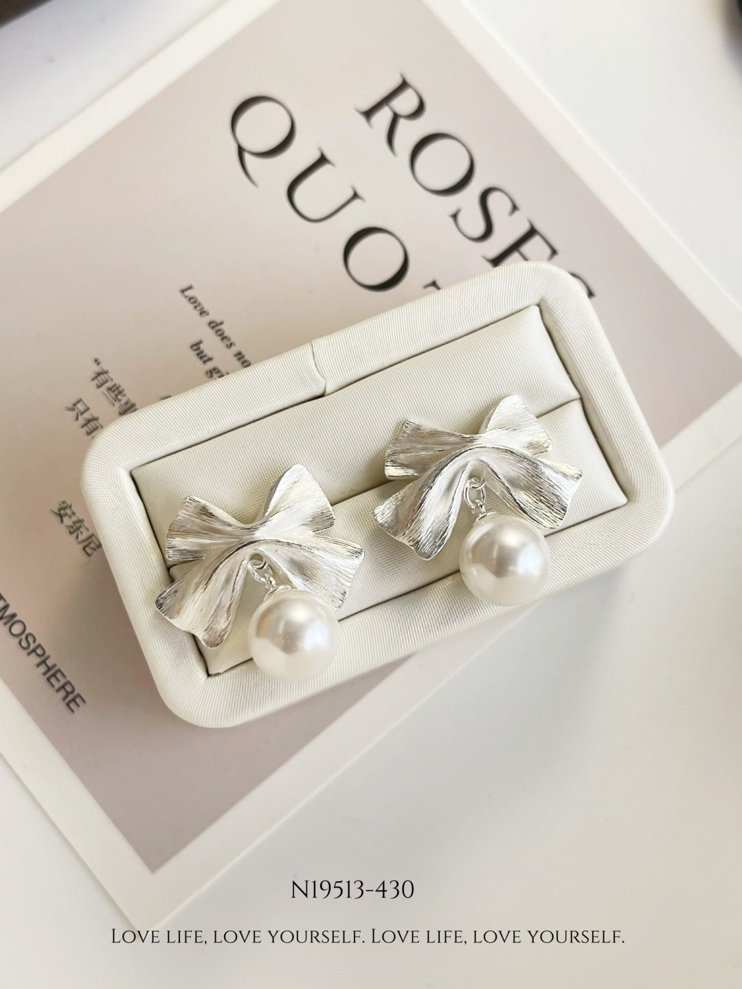 Elegant Pearl Bow Earrings