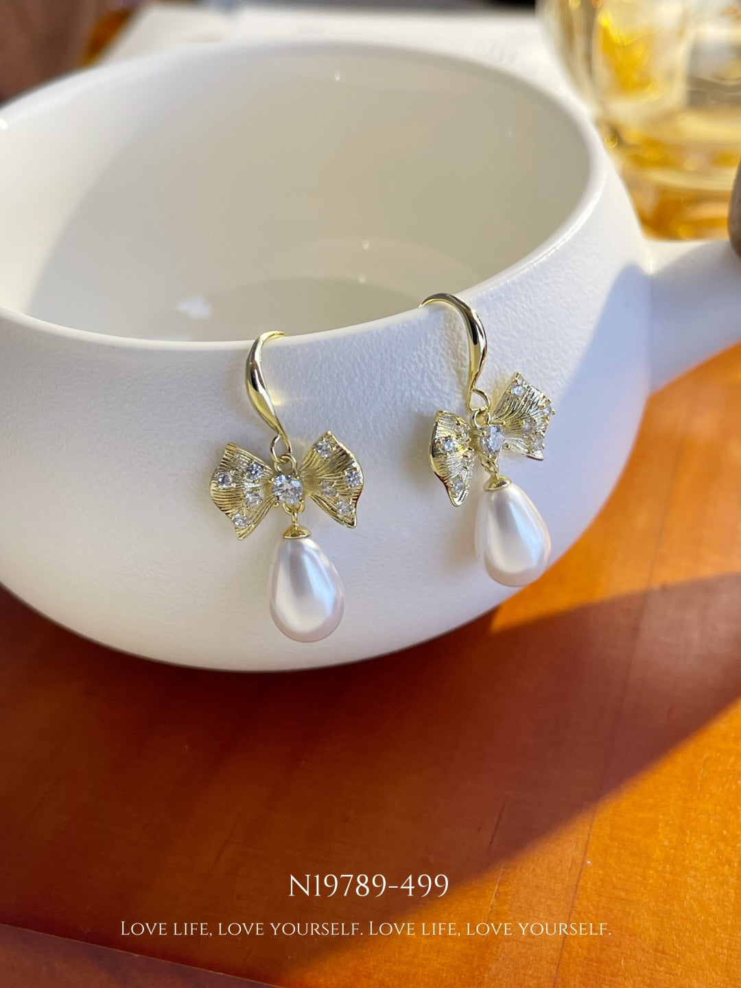 Crystal Bow & Teardrop Pearl Dangle Earrings