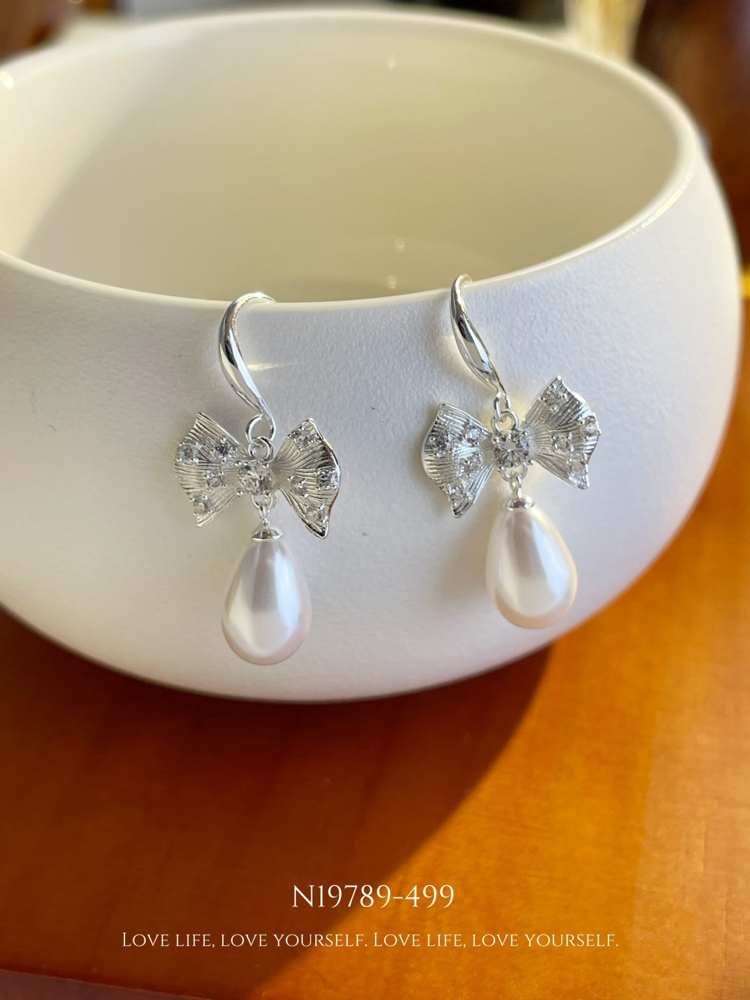 Crystal Bow & Teardrop Pearl Dangle Earrings