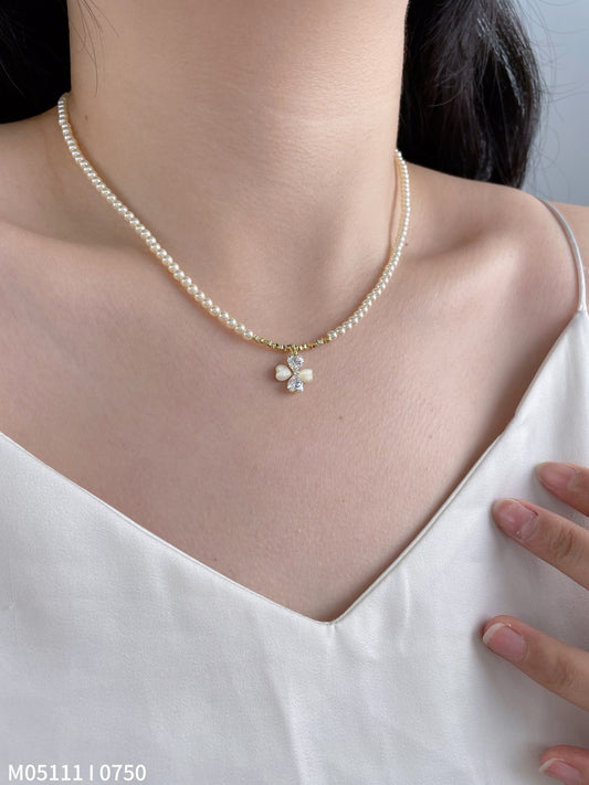 Women's pearl necklace with bow charm