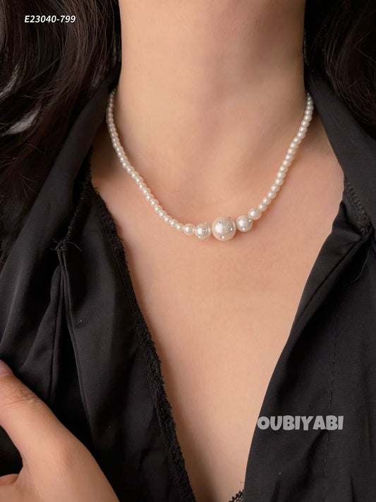 Graduated pearl necklace front view on model