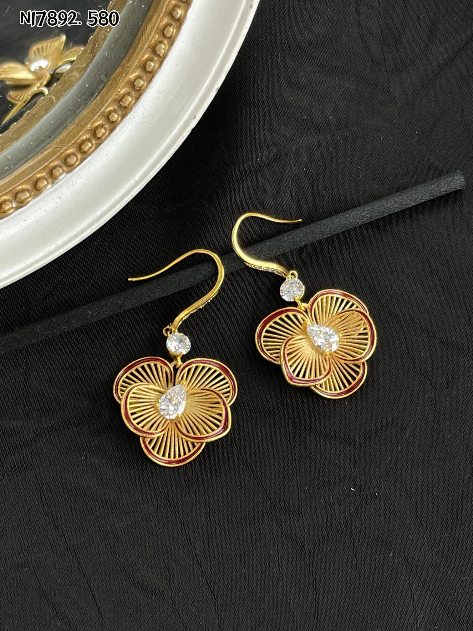 Detailed gold metal flower earrings
