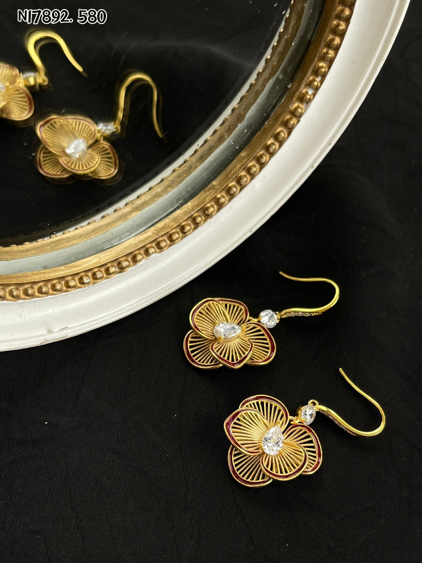 Detailed gold metal flower earrings