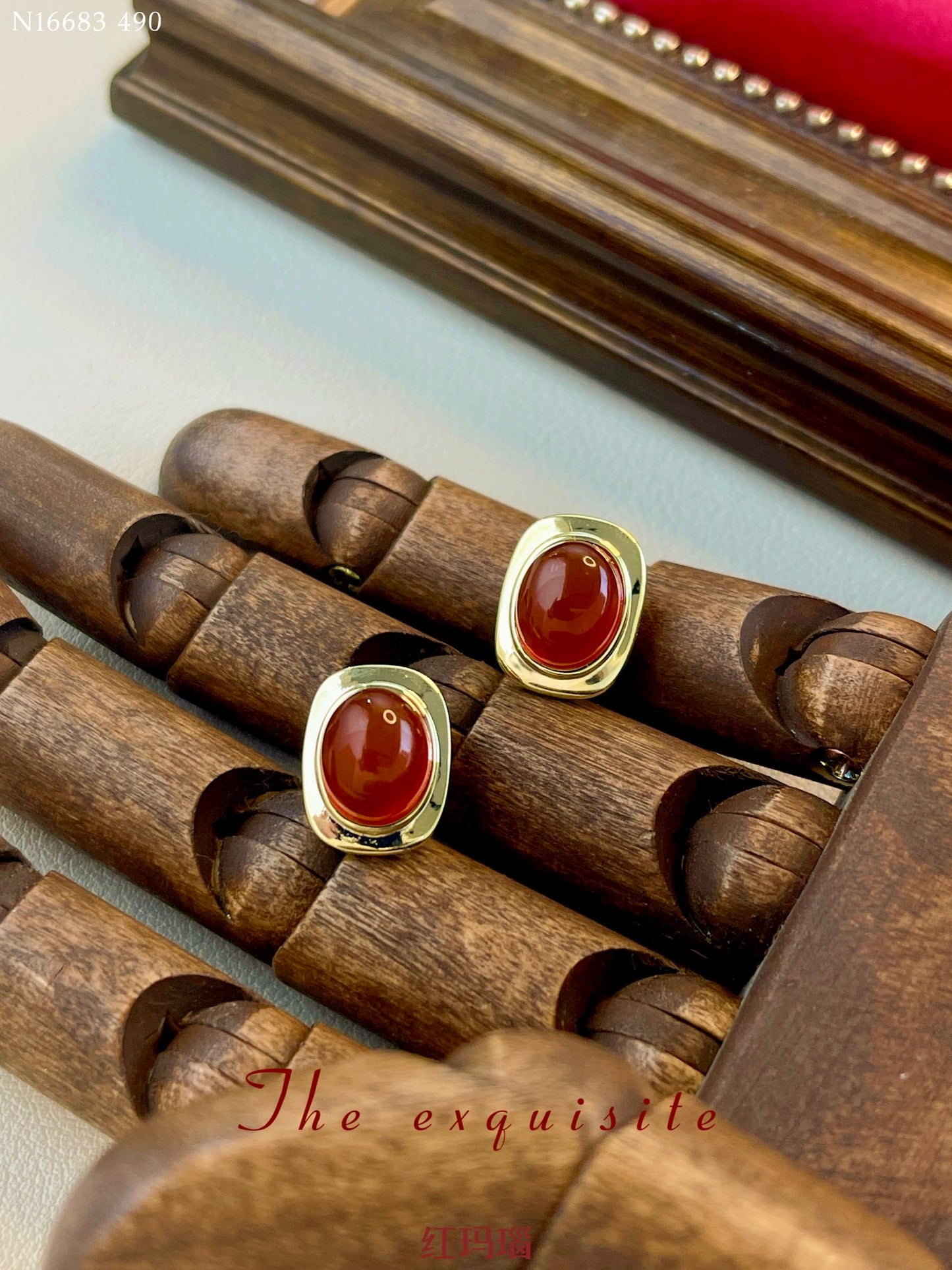 Gold-rimmed red agate earrings