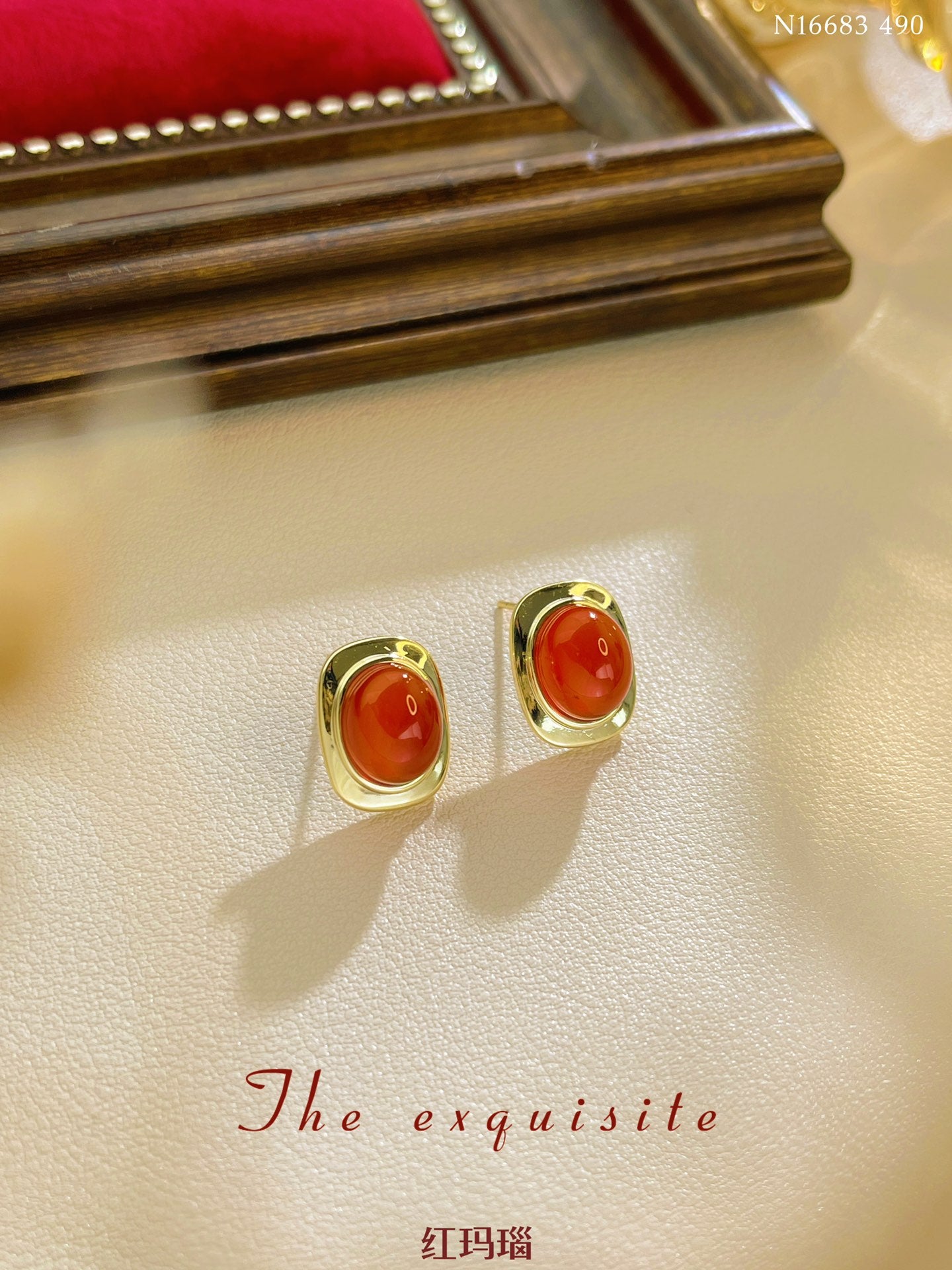 Gold-rimmed red agate earrings
