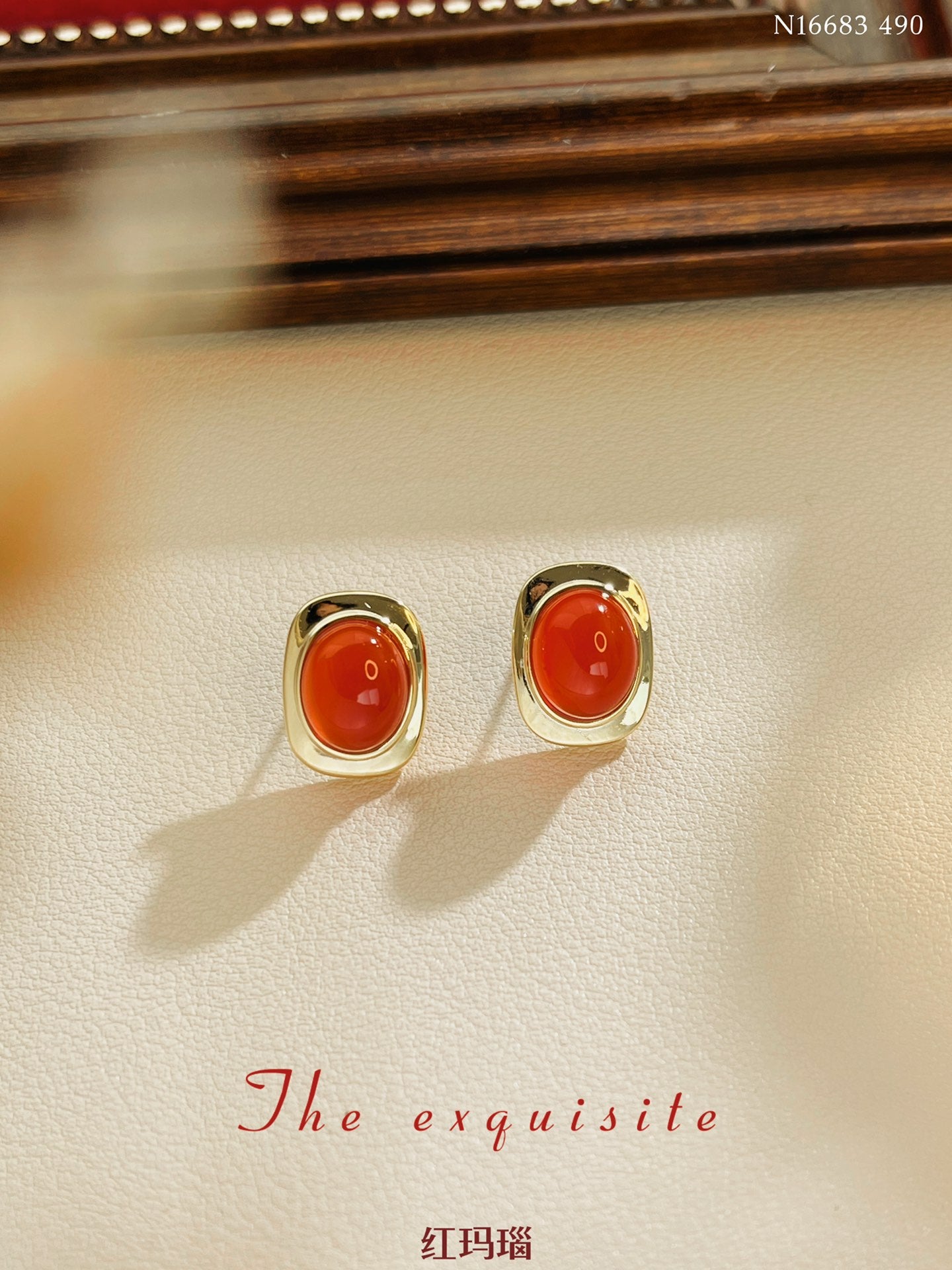 Gold-rimmed red agate earrings